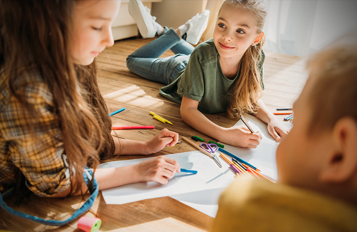 Little Girl Drawing With Other Children